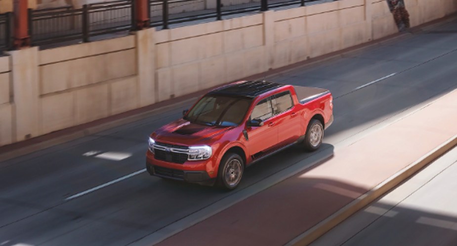 A red 2022 Ford Maverick small pickup truck. 