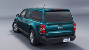 A green Ford Maverick with a bed cap.