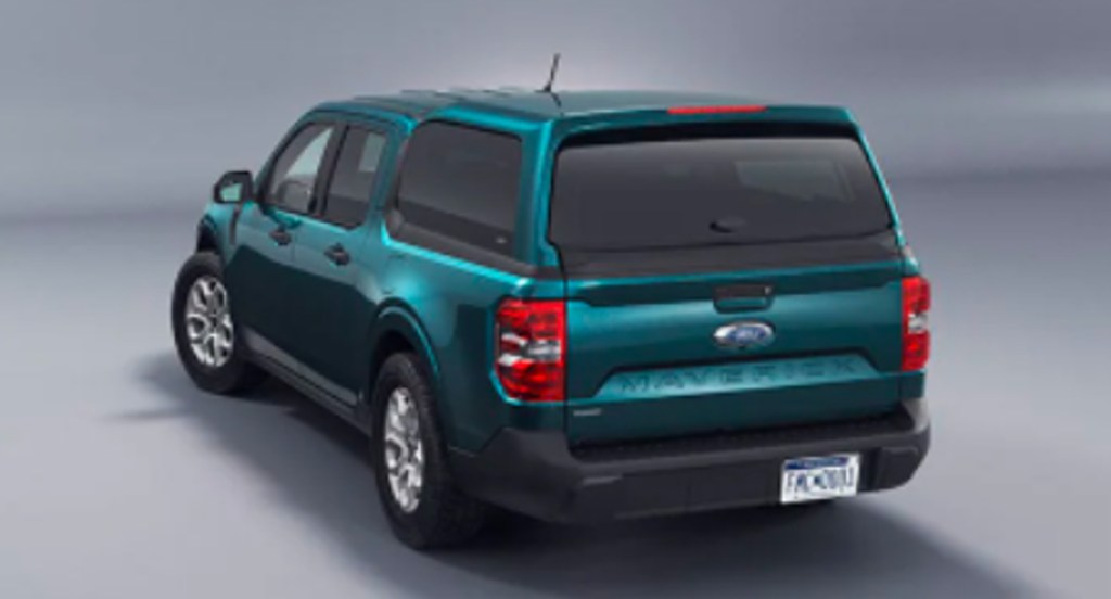 A green 2022 Ford Maverick small SUV with a bed cap. 