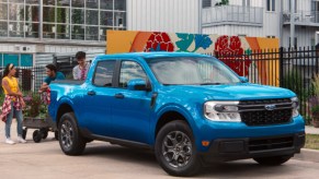 A blue 2022 Ford Maverick small pickup truck is parked.