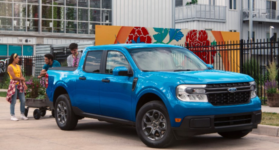 A blue 2022 Ford Maverick small pickup truck is parked.