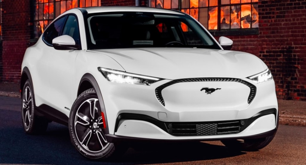 A white 2022 Ford Mustang Mach-E electric SUV is parked outdoors. 