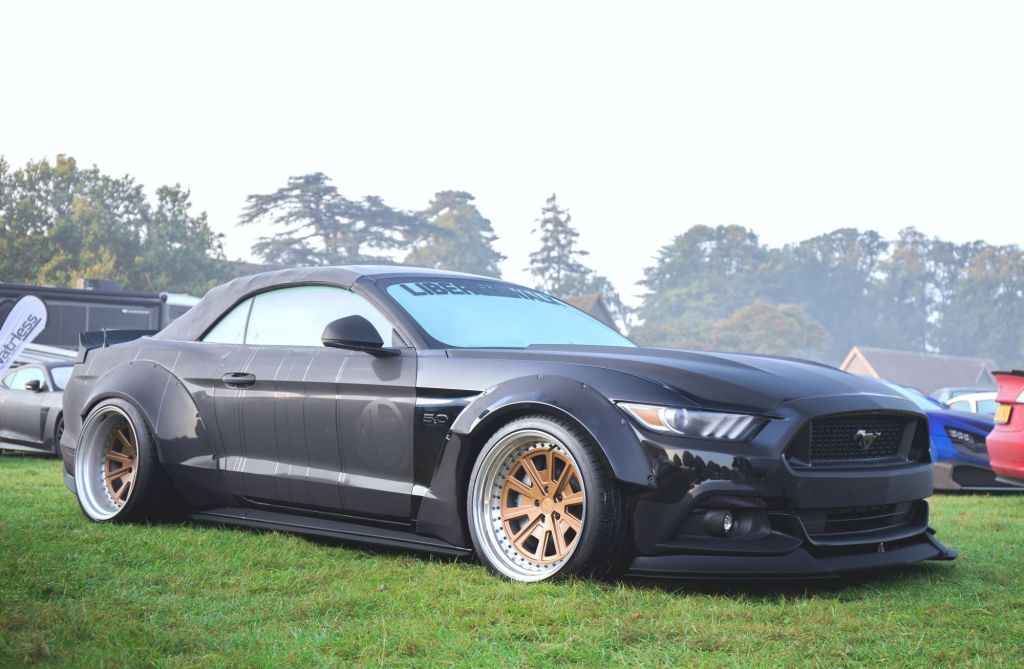 A black Ford Mustang coupe, considered one of the best used sports cars. 