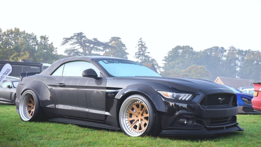 A black Ford Mustang Coupe, included as one of the best used sports cars.