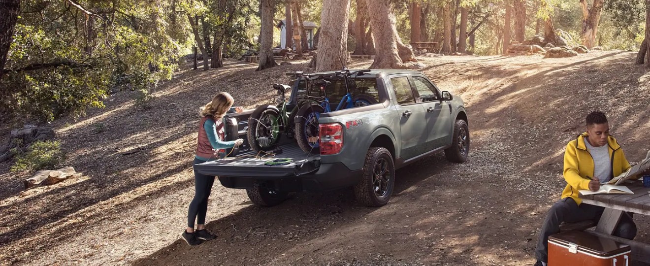 A 2022 Ford Maverick demonstrates its off-road capability as a compact truck.