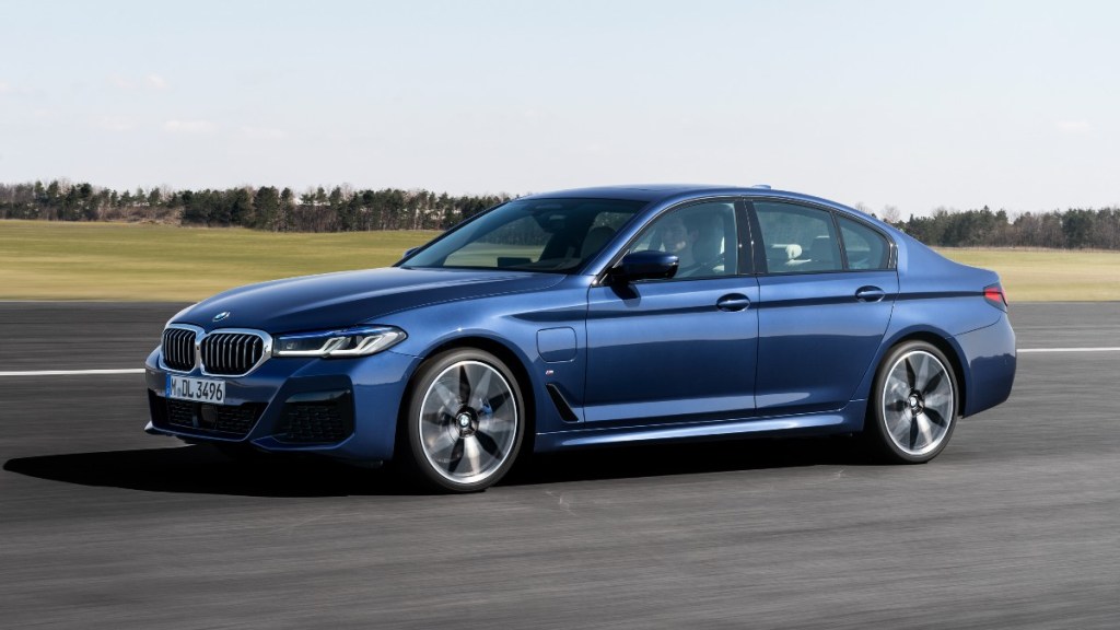 Front angle view of blue 2023 BMW 5 Series, highlighting its release date and price
