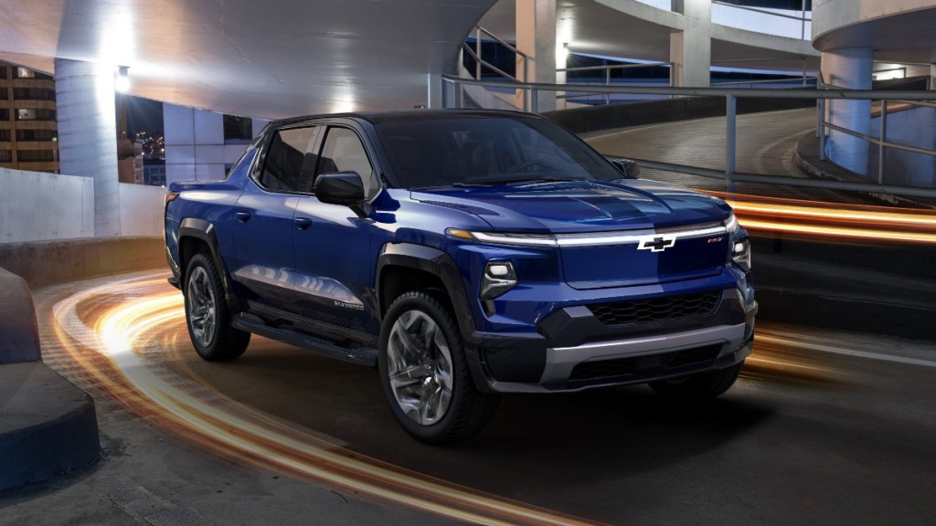 Front angle view of blue 2024 Chevy Silverado EV, highlighting video released after launch of Ford F-150 Lightning
