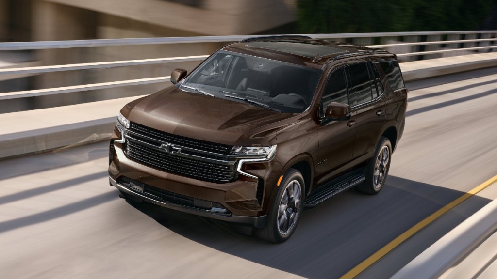 Front angle view of brown 2023 Chevy Tahoe, highlighting its release date and price