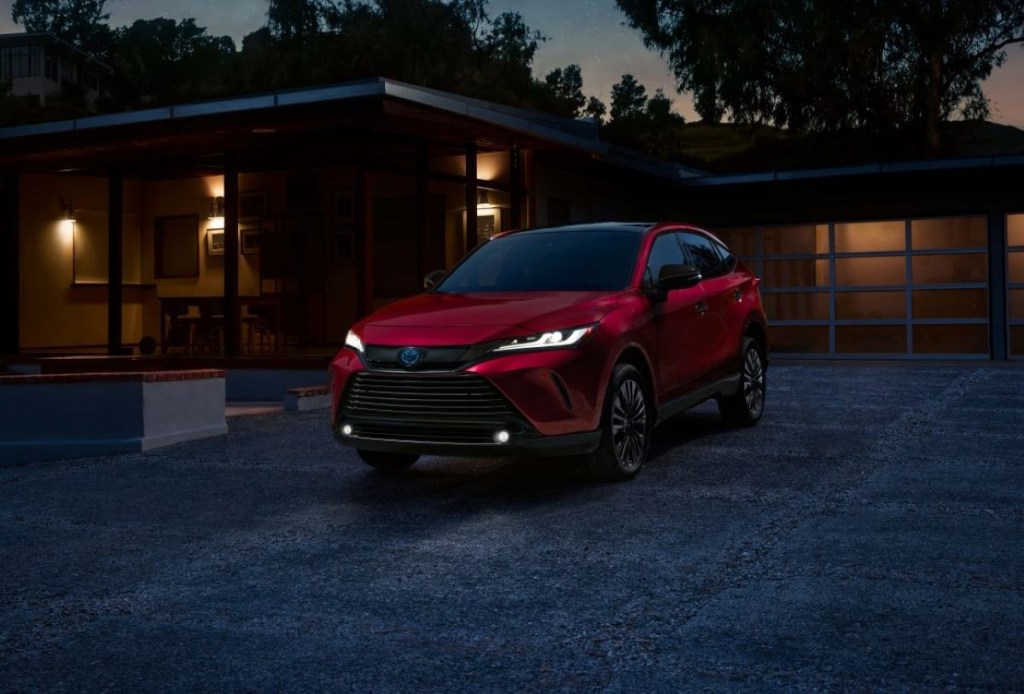 Front angle view of red 2023 Toyota Venza, highlighting its release date and price