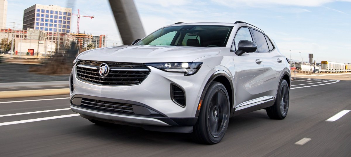 Front angle view of white 2023 Buick Envision, highlighting its release date and price