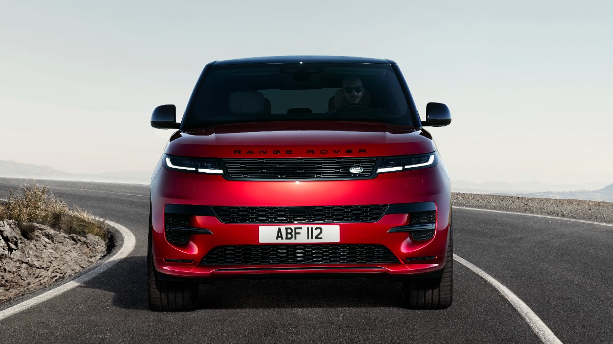 Front view of red 2023 Land Rover Range Rover Sport, highlighting its release date and price