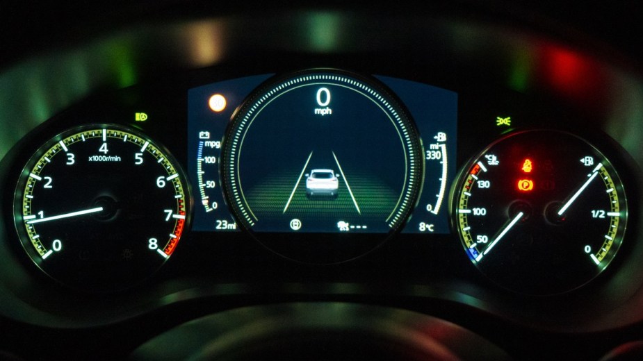 the instrument cluster on a car showing of a full fuel gauge and mileage until empty