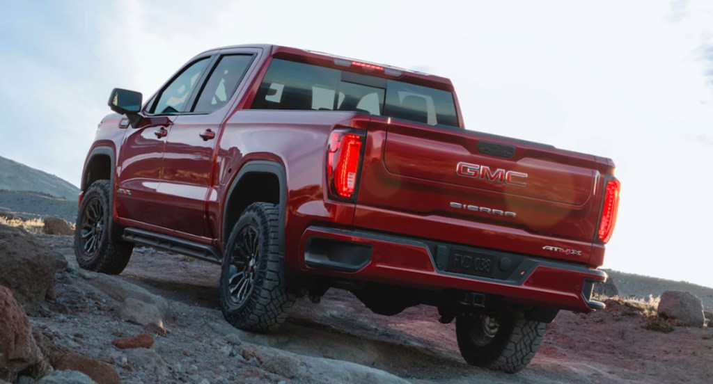 A red 2022 GMC Sierra 1500 AT4X is off-roading. 