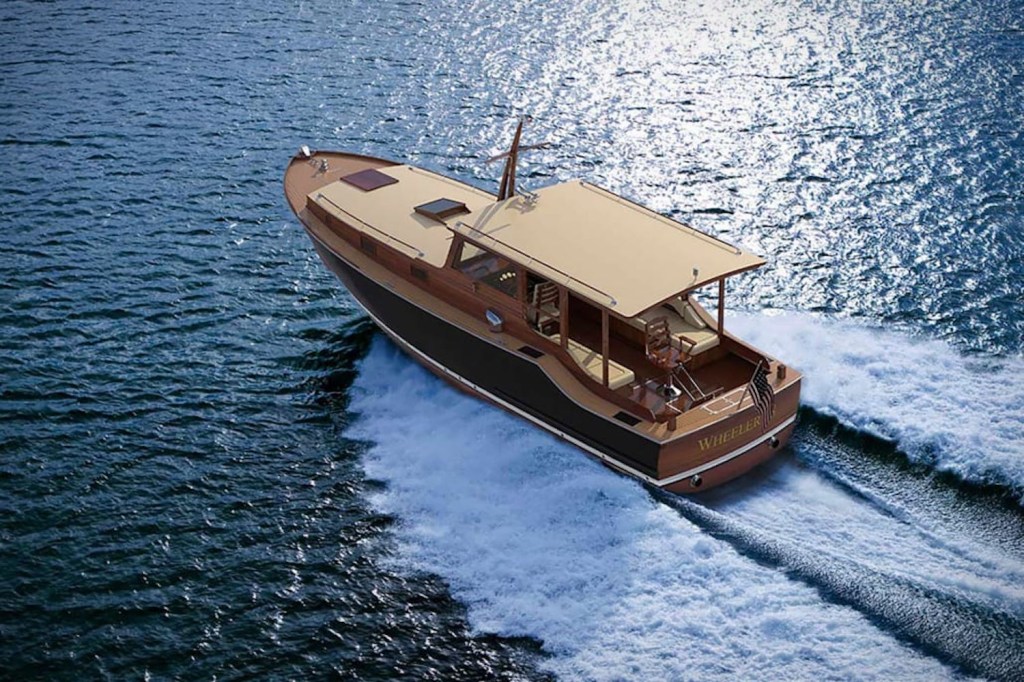 Birds eye view of the new Wheeler 38 wooden yacht cutting through a calm sea.