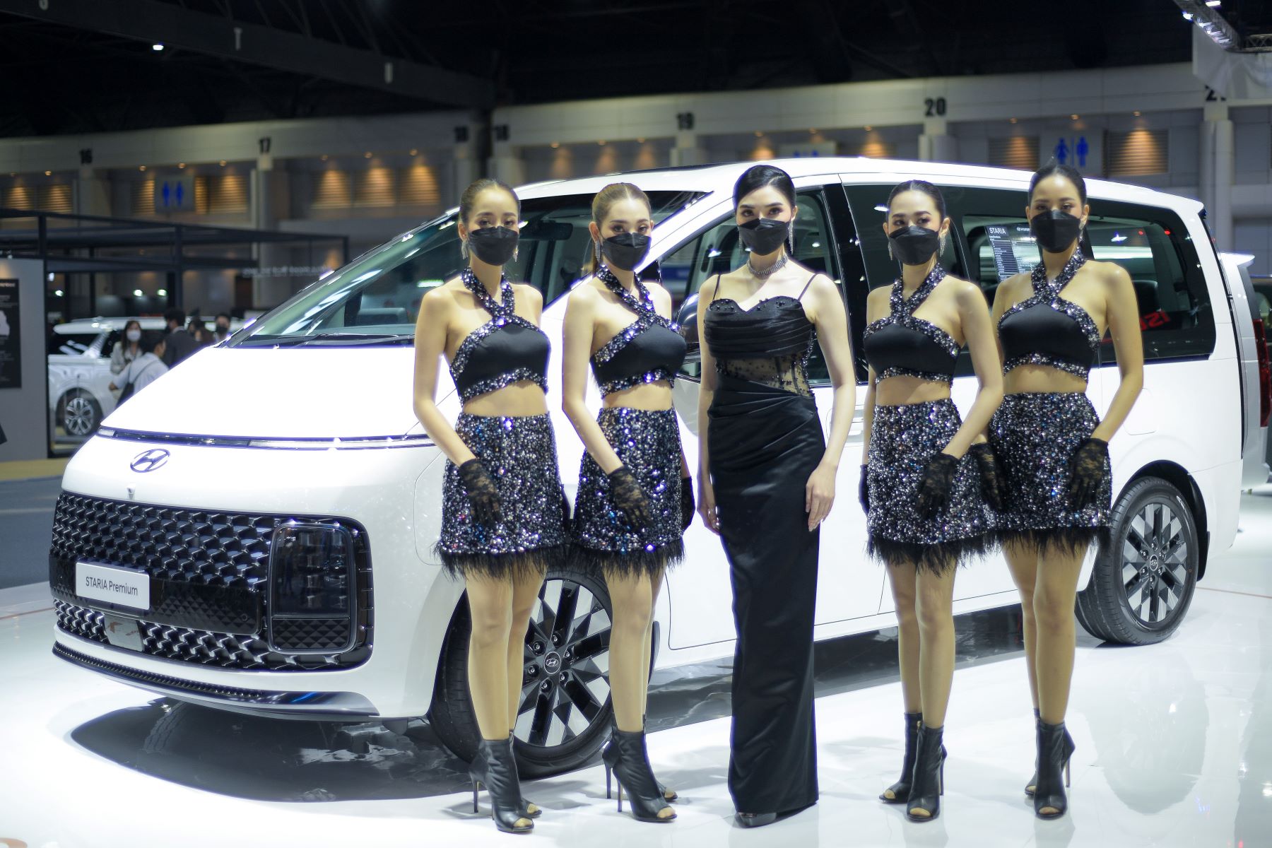 A group of presenters in front of the Hyundai Staria Premium model at the 43rd Bangkok International Motor Show