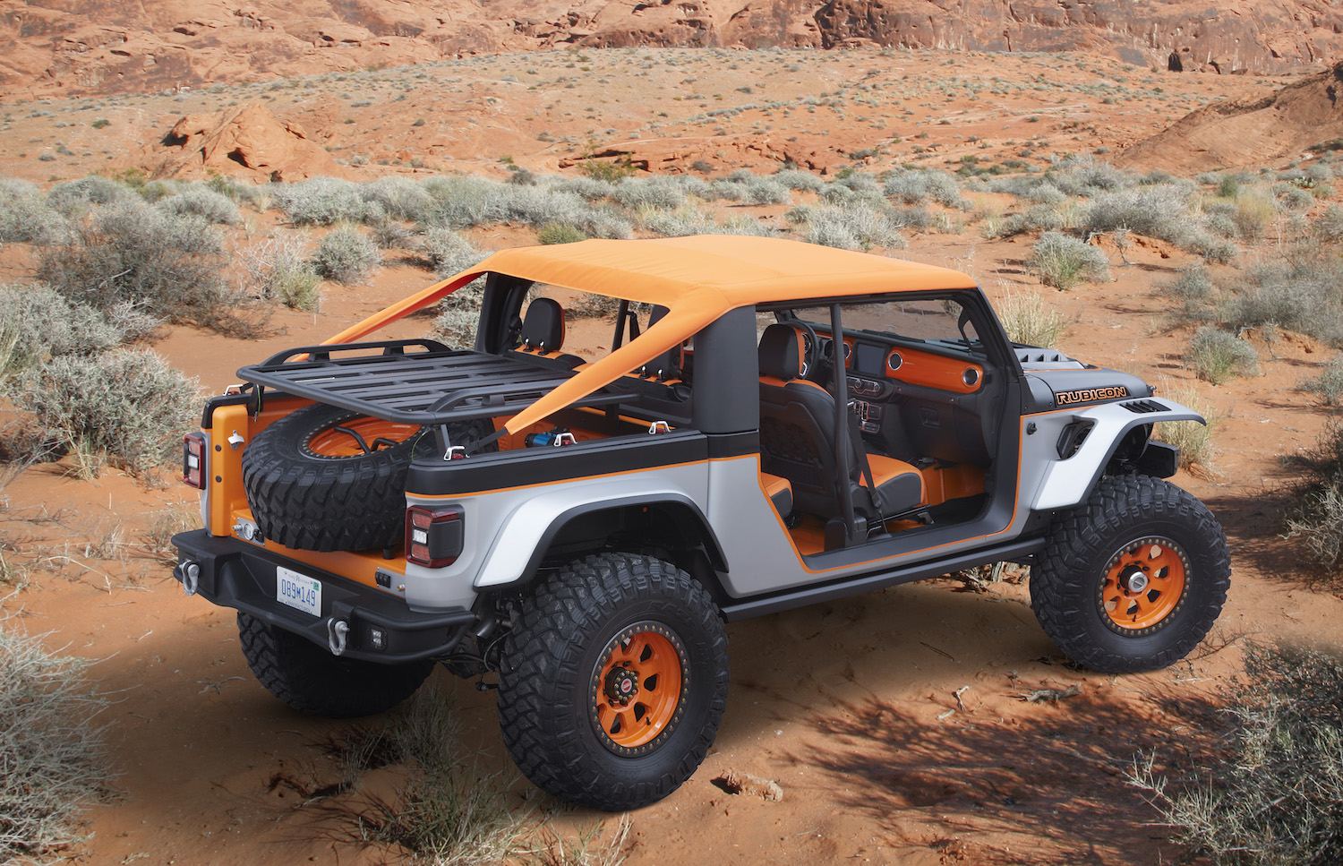 Shortened Jeep Gladiator concept truck with orange convertible roof.