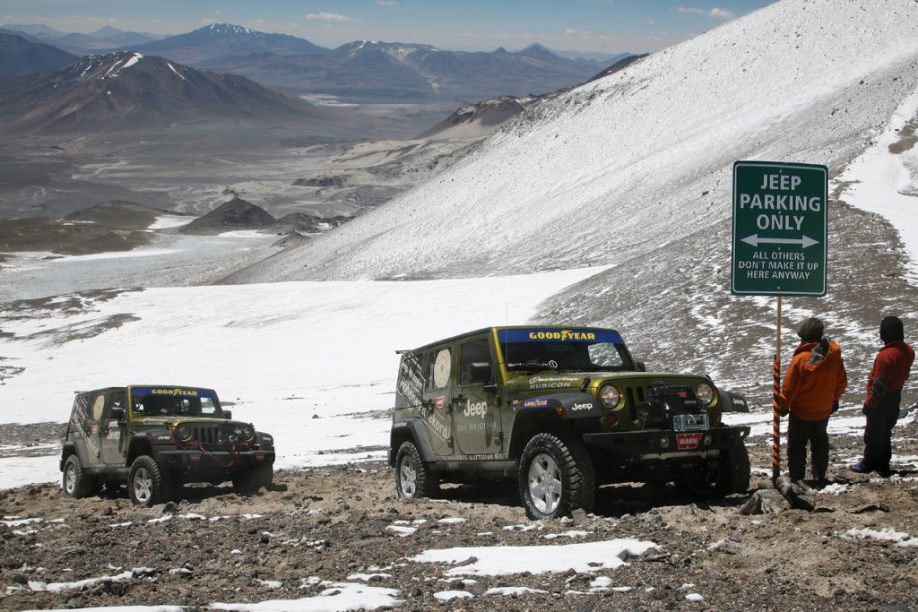 Two 2007 Jeep Wrangler Rubicons parked on the slopes of a volcano in Chile after setting an altitude record.