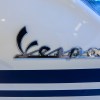 closeup of white Vespa sprint logo much like the model Justin Bieber collaborated on