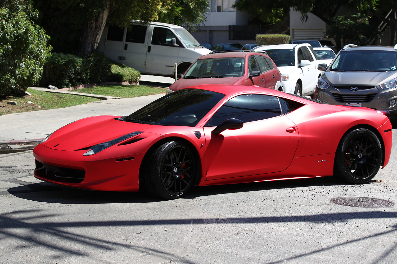 Justin Bieber spotted driving his matte red Ferrari 458 in Hollywood