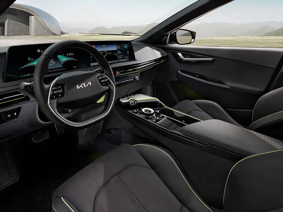 The interior of the Kia EV6 GT shows how it is focused on the driver. Yellow stitching and accents can be seen throughout.
