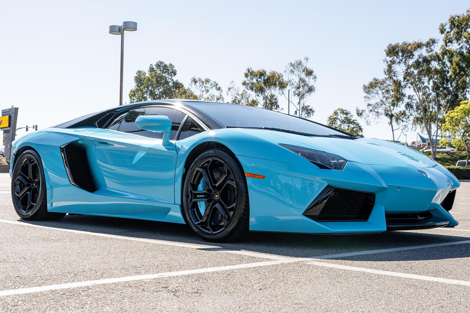 Custom painted Miami Blue Lamborghini Aventador sitting in Beverly Hills California