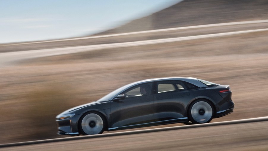 a 2022 lucid air grand touring performance tackles a country road