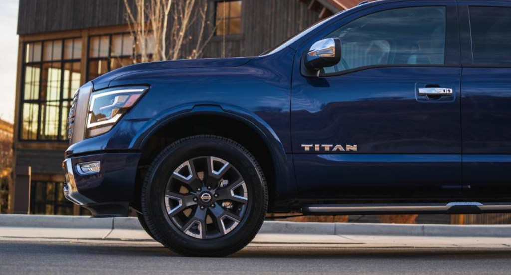The front of a blue 2022 Nissan Titan full-size pickup truck.