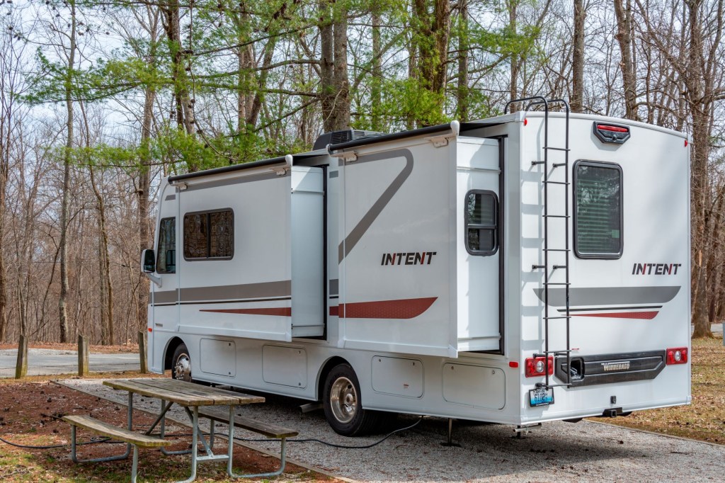 An RV parked outdoors at an RV campground.