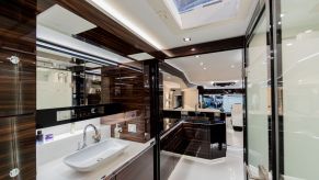 Inside of a high-end RV bathroom with a sink and a shower.