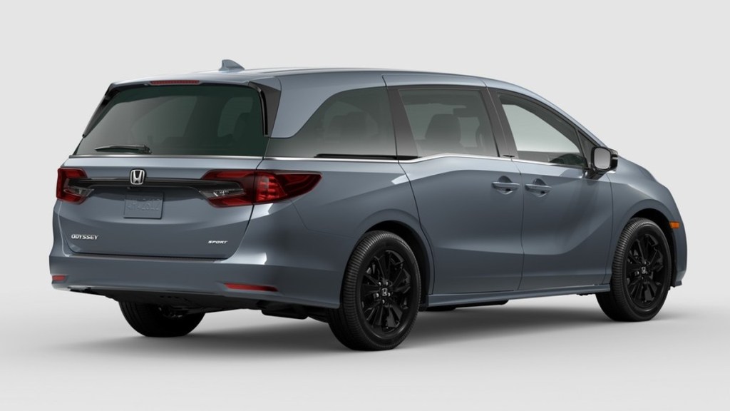 Rear angle view of Sonic Gray Pearl 2023 Honda Odyssey, highlighting its release date and price