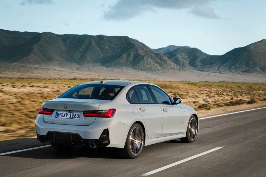Rear angle view of gray 2023 BMW 3 Series, highlighting its release date and price