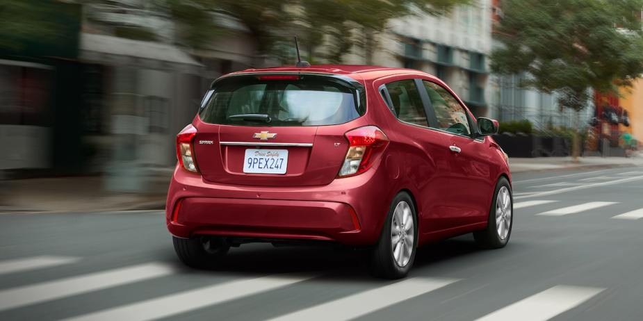 Rear angle view of red 2022 Chevy Spark, the only American car that costs less than $15,000