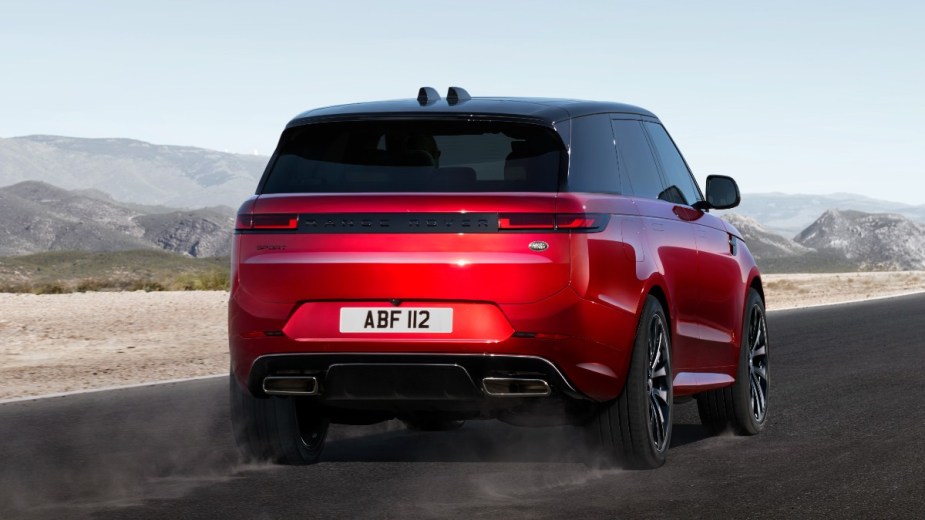 Rear angled view of the red 2023 Land Rover Range Rover Sport, highlighting its release date and price