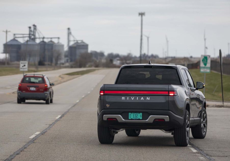 Rivian R1T, potentially a Rivian R1T exterior issues, driving down the road.