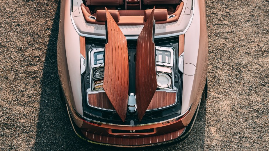 the trunk of the rolls-royce boat tail os a split-open covered in royal walnut veneer
