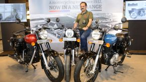 Royal Enfield Global Head of Brand Shubhranshu Singh posed with Bullet motorcycle models in Amritsar, India