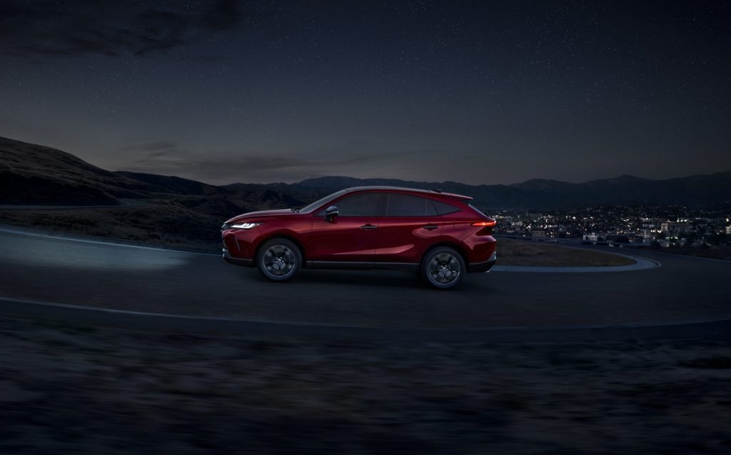 Side view of red 2023 Toyota Venza, highlighting its release date and price