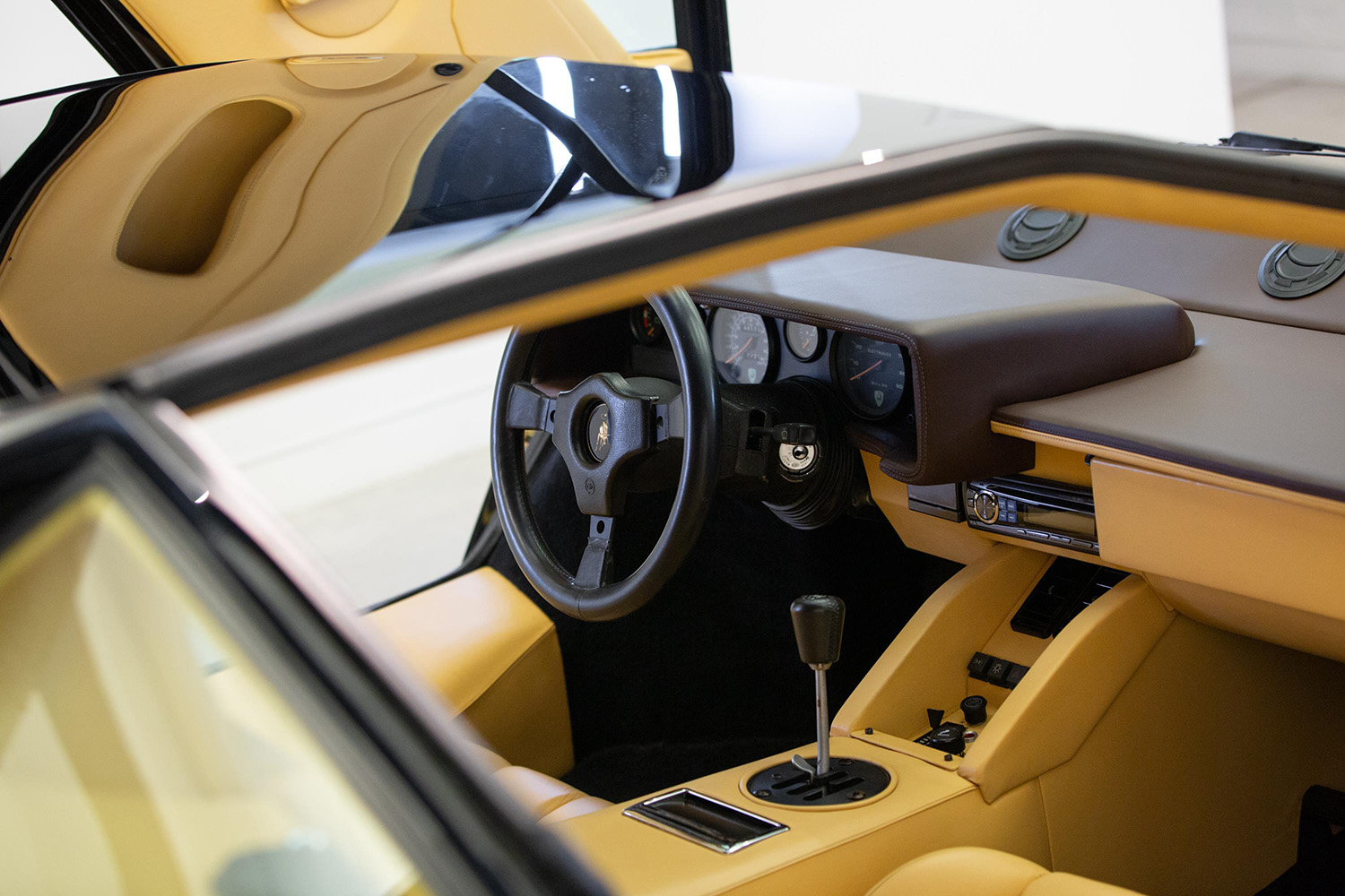 Tna interior inside black Lamborghini Countach with doors open