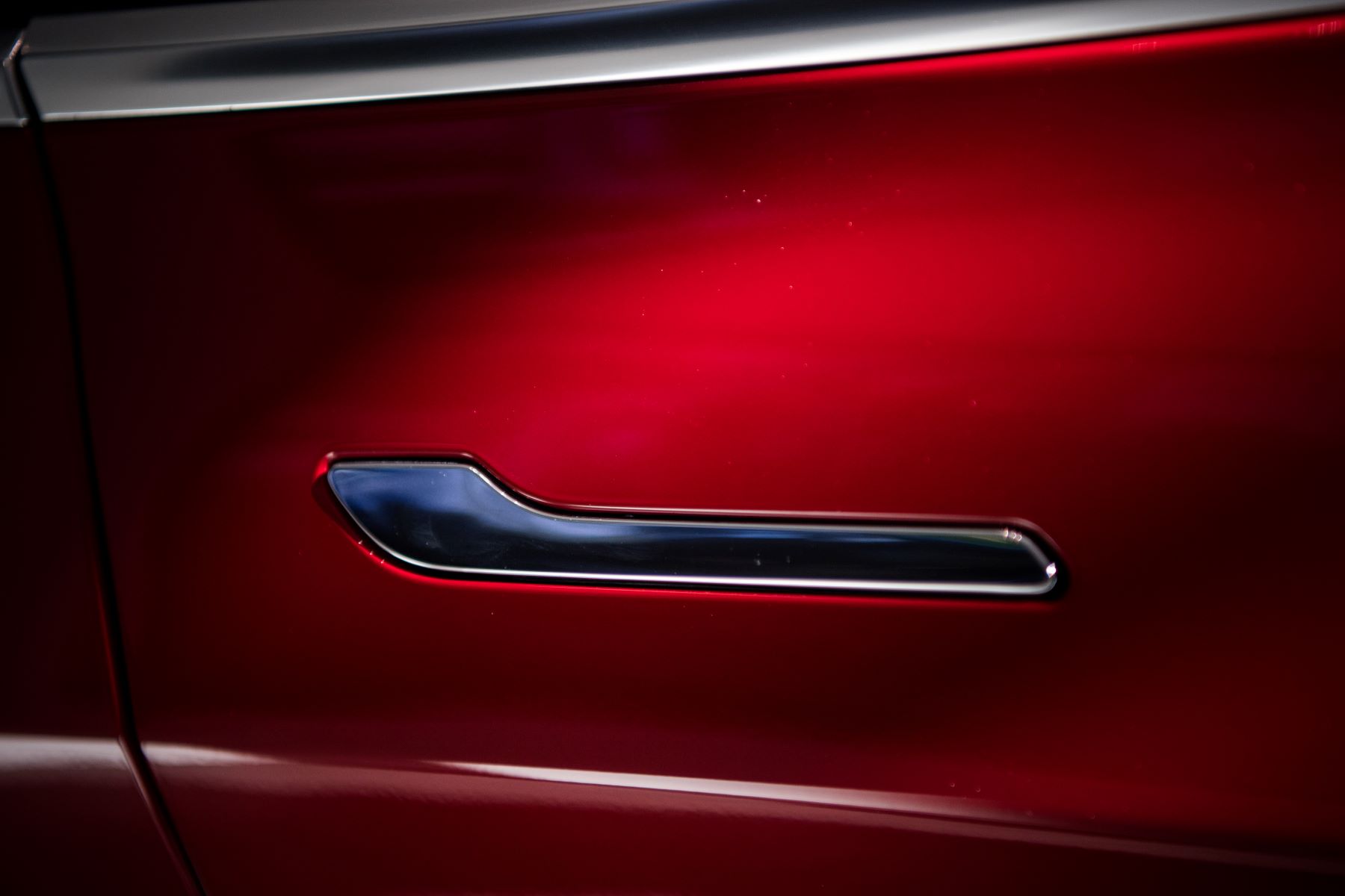 A pop-out car door handle on a Tesla Model 3 electric vehicle on display in Washington, DC