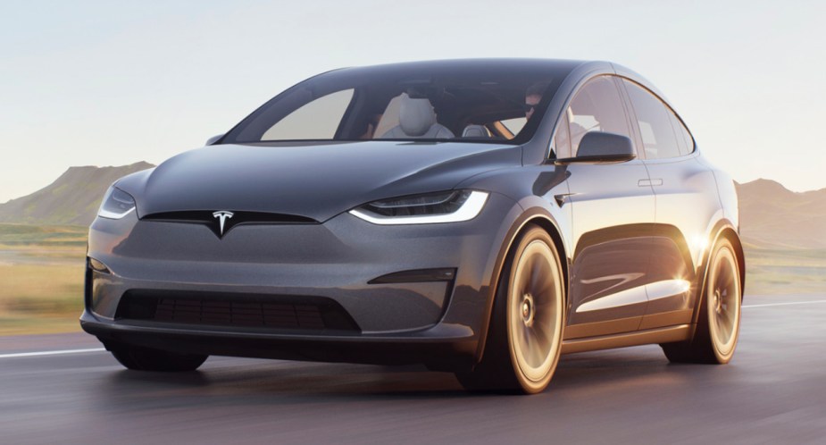 A gray 2022 Tesla Model X electric luxury midsize SUV. 