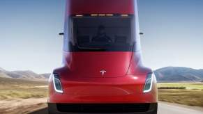 A man drives a Tesla semi truck, which can be reserved for $20,000
