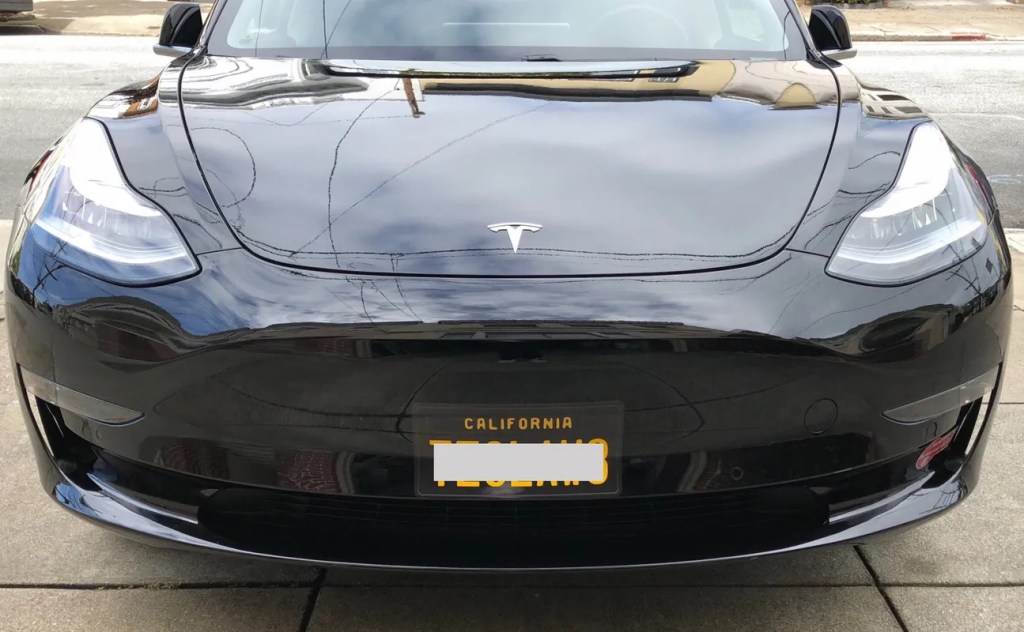 A front license plate wrap is the perfect way around an ugly front license plate bracket with holes in the bumper.