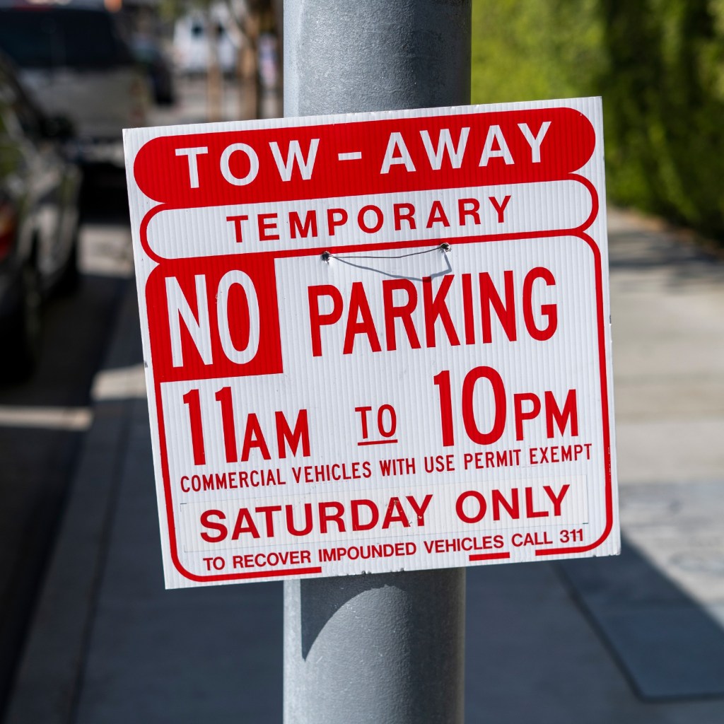 Towing Enforced Sign tells you when you can't park in this area