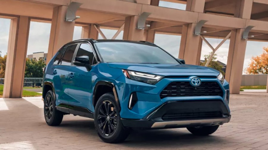 A blue 2022 Toyota RAV4 Hybrid small SUV is parked outdoors.