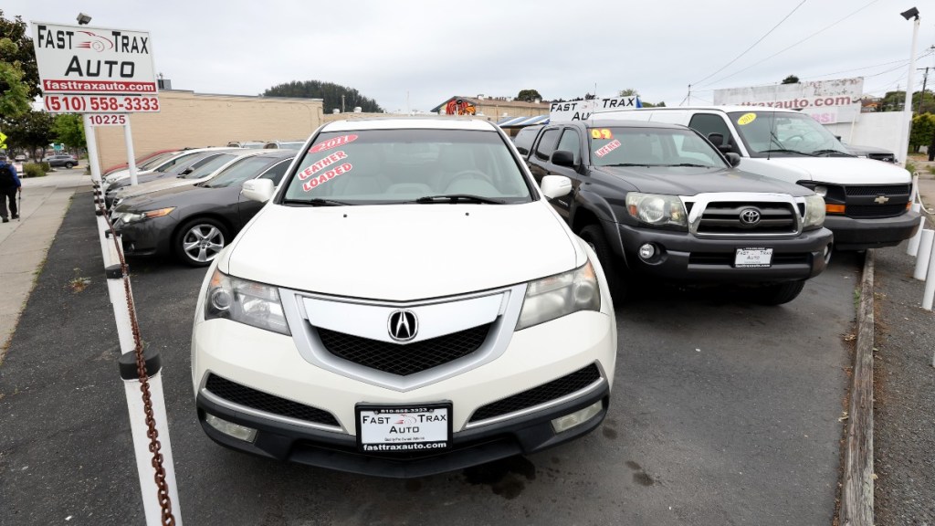 a used car dealership loaded up with a variety of used models