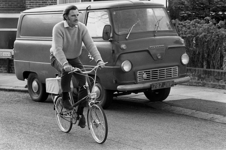 black and white photo of a vintage ford van