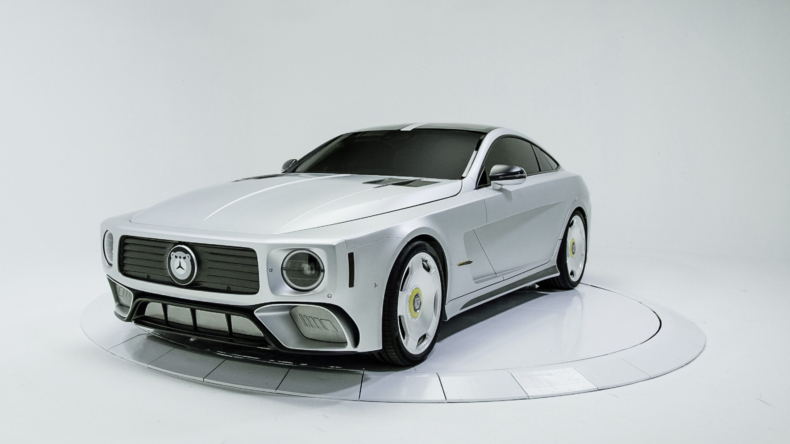 The white WILL.I.AMG Mercedes-AMG GT 4-Door concept in a white studio