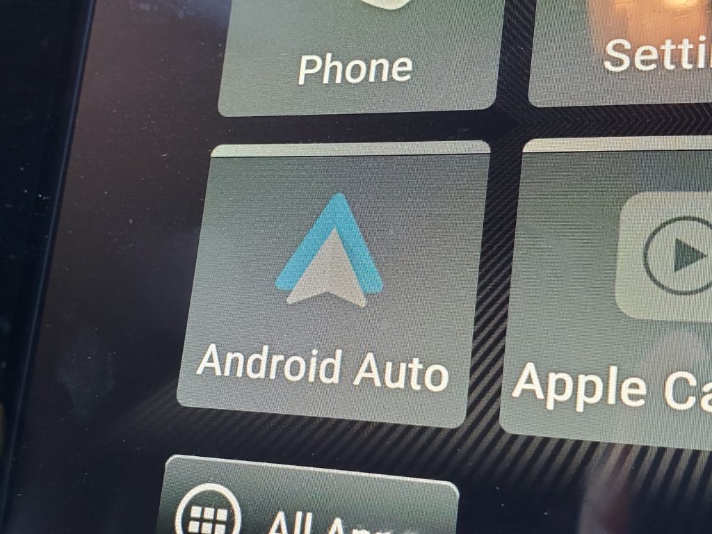 Close-up of the Android Auto reading code on the car's display.
