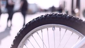Close-up of a heavily treaded bike tire. Cordless tire inflators work on more than just car tires.