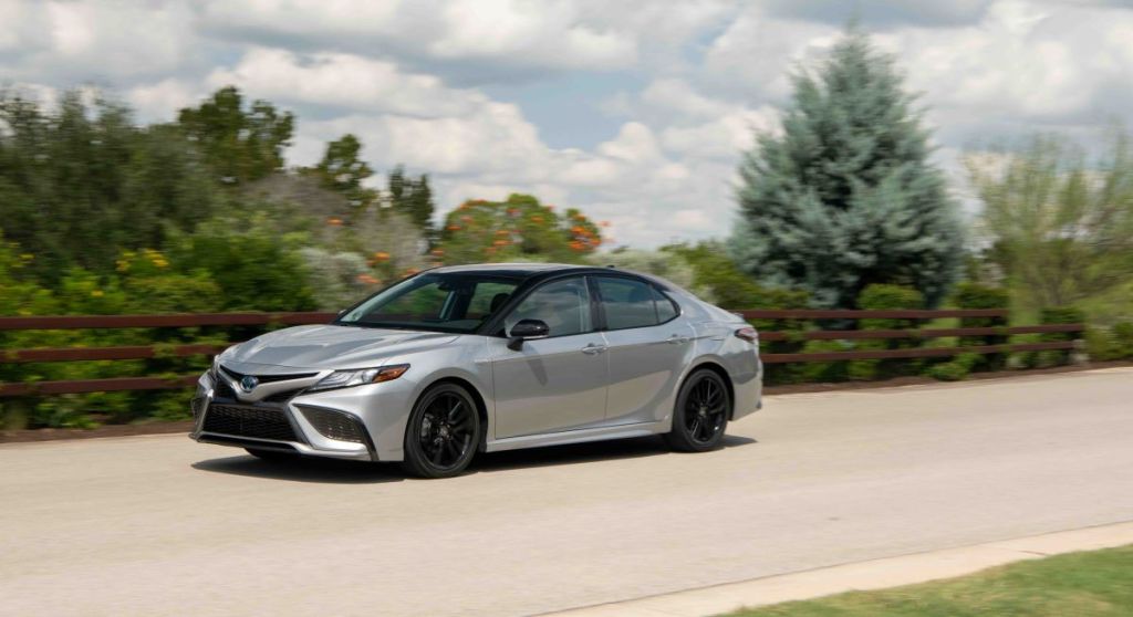 Silver 2022 Toyota Camry Hybrid, an affordable and fuel-efficient competitor to the 2022 Toyota Prius Prime plug-in hybrid